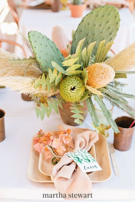 For a destination shower—or a desert-inspired event—cacti are a must. MV Florals added two large cactus leaves to this non-floral design. #weddingideas #wedding #marthstewartwedding #weddingplanning #weddingchecklist Cactus Wedding Decor, Cactus Centerpiece, Non Floral Centerpieces, Succulent Wedding Centerpieces, Cactus Wedding, Wedding Centerpiece Ideas, Mexican Party Theme, Bridal Shower Flowers, Bridal Shower Centerpieces