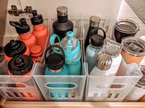 Blender Bottle Organization, Vitamin Storage Kitchen, Classroom Water Bottle Station, How To Organize Water Bottles, Water Bottle Station Classroom, Classroom Water Bottle Storage, Water Bottle Organization Ideas, Organizing Water Bottles, Tumbler Organization