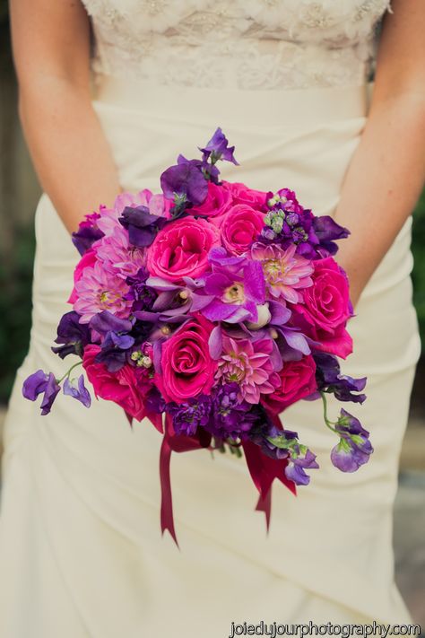 A bold bridal bouquet of hot pinks and purples, flowers included are hot pink roses, fuchsia dendrobium orchids, purple sweet peas, lavender dahlias, purple mokara orchids and purple stock. This beautiful wedding was held at Christ Church Cathedral in New Orleans, followed by reception at Broussard's Restaurant. Fuchsia Wedding, Bouquet Bride, Purple Bouquet, Boda Mexicana, Purple Wedding Flowers, Spring Wedding Flowers, Sophisticated Bride, Wedding Table Flowers, Pink Wedding Flowers