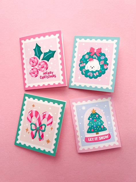 "This 4 Mini Christmas Stamps card set is perfect for a quick festive note and to add a finishing touch to a gift.   2.5\" W x 3\" H 4 mini cards & white envelopes Blank inside Made in Los Angeles" Christmas Cards Cricut, Mini Christmas Cards, Christmas Cards Cute, Pink Christmas Cards, Cat Christmas Cards, Christmas Envelope, Retro Christmas Cards, Funny Holiday Cards, Holiday Cards Handmade