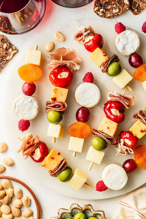 Tired of seeing the same charcuterie board ideas? Try these charcuterie skewers instead! With meats, cheeses, fruit, pickled items, and more, these are one of my favorite finger foods for a party! You can even add them to a regular charcuterie board if you like. Or, try a vegetarian version by leaving off the meat. These appetizer skewers are unique, easy to make, no-cook, and amazing for grazing. Serve charcuterie on a stick for parties or holidays like Easter, Thanksgiving, and Christmas. Charcuterie Sticks Ideas, Charcuterie Stick Ideas, Charcuterie Skewers, Pickled Items, Prosciutto Roll, Simple Charcuterie, Appetizer Skewers, Fruit Sticks, Skewer Appetizers