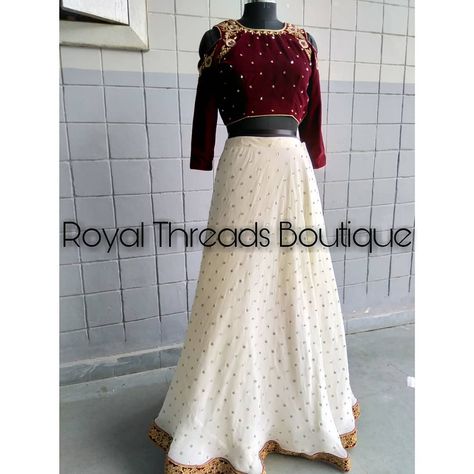 Modern yet Royal! 👑  Maroon velvet crop top paired with white lehenga! Hand embroidered  For order Whatsap Velvet Crop Top Designs For Lehenga, White Lehenga, Simple Frocks, Maroon Blouse, Crop Top Designs, Kurti Designs Latest, Velvet Crop Top, Kurti Designs, White Skirts