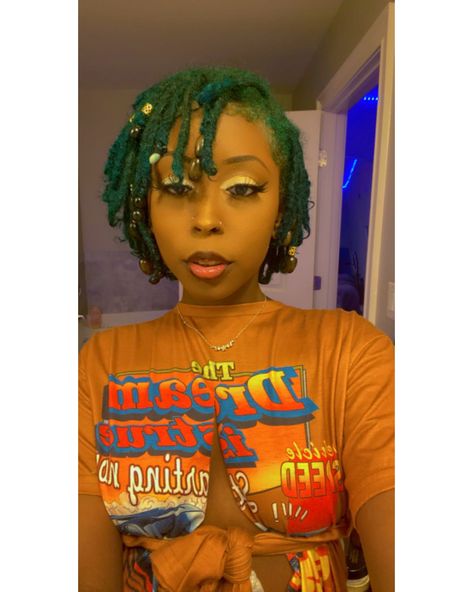 Green locs with beads Short Loc Styles With Beads, Beads On Short Locs, Blue And Green Locs, Green Locs Black Women, Dark Green Locs, Short Locs With Beads, Dreads With Beads, Locs With Beads, Peak A Boo Hair