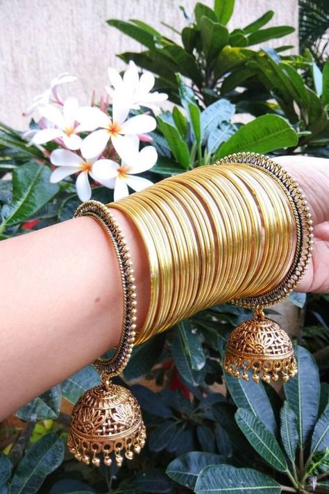 GOLDEN LIGHTWEIGHT JHUMKI BANGLES WITH SHINING METAL FOR TRENDY LOOK Golden Bangles Design, Bangles Design Latest, Women Gold Bangles, Golden Jhumka, Bridal Jewellery Earrings, Bridal Jewels, Perhiasan India, Bridal Jewelry Vintage, Glass Bangles