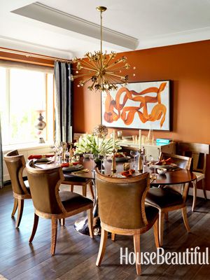 Orange dining room. Design: Heather Moore. Photo: Thomas Loof. housebeautiful.com #orange_walls #movie_inspirations #dining_table Orange Dining Room, Orange Paint Colors, Retro Dining Rooms, Most Popular Paint Colors, Fall Dining Room, Autumn Dining, Popular Paint Colors, Living Room Orange, Orange Walls