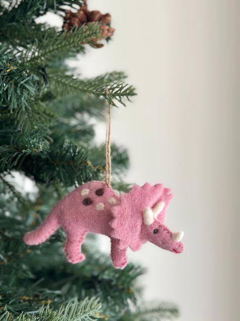 PRICES MAY VARY. Designed in Florida, handcrafted by talented female artisans in Nepal. Captures holiday spirit with unique artistry. Adds warmth and tradition to your tree. Intricate details showcase their craftsmanship. Symbolizes dedication by Ganapati Crafts Co. Our lovely hand-stitched wool-felt dinosaur ornaments will transport you to a prehistoric wonderland. Featuring triceratops, plesiosaur, brontosaurus, T-rex, and stegosaurus, each dinosaur has its own unique charm and is crafted with Felt Animals Christmas, Felt Animal Christmas Ornaments, Felt Stocking Ornaments, Felt Christmas Decorations Patterns Free, Felted Dinosaur, Felt Patterns Free, Felt Dinosaur, Dinosaur Christmas Ornament, Dinosaur Ornament