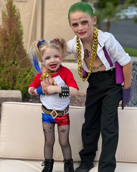 Daddy’s little monster shirt, red and blue shorts, spiked belt, studded jewelry, Harley Quinn tattoos, Harley Quinn costume, green slicked back hair, white button down shirt opened up, black slacks, joker tattoos, suicide squad movie. Kids Joker And Harley Quinn Costume, Toddler Harley Quinn Costume, Kid Joker Costume, Harley Quinn Costume Toddler, Diy Harley Quinn Costume For Kids, Toddler Joker Costume, Super Hero Family Costumes, Harley Quinn And Joker Costume Couple, Harley Quinn And Joker Costume