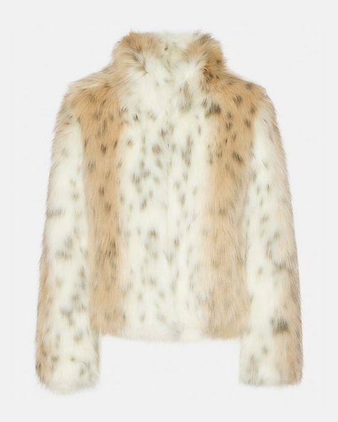 Stay warm and stylish with the WILD DREAM jacket . The faux fur material and leopard print add a touch of glamour while the collar provides extra coziness. Upgrade your winter wardrobe with this mob wife inspired piece.  Faux fur coat with collar Two functional side pockets Hook and eye closure Length: 24" Self: 60% modacrylic, 40% acrylic Lining: 95% polyester, 5% elastane Hand wash Nina is 5ft 10in and is wearing a size small Imported Faux Fur Material, Leopard Jacket, Mob Wife, Faux Fur Fabric, Fur Fabrics, Slip Skirt, Print Trends, Snow Leopard, Chic Outfit