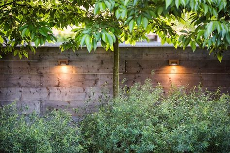 Outdoor wall lights are specifically designed and approved for wet location use; these from Royal Botania. Thoroughly informative post: Hardscaping 101: Outdoor Wall Lights by Janet Hall. via Gardenista Elegant Landscape, Royal Botania, Paper Garden, Log Wall, Japanese Interiors, Front Yard Fence, Fence Lighting, Backyard Fences, Wooden Fence