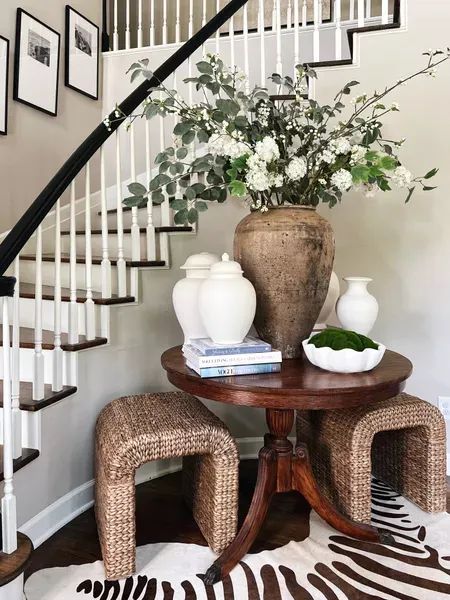 Large Round Entry Table, Foyer Table With Stools, Round Foyer Tables, Round Table By Staircase, Round Table Hallway, Round Table Foyer Entryway Stairs, Entry Way Round Table Decor, Foyer Ideas Entryway Round Table, Styling Round Entry Table