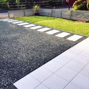 Black Gravel Driveway Ideas With Concrete Stepping Stones Gravel Driveway Ideas, Gravel Drive, Gravel Landscaping, Driveway Ideas, Concrete Stepping Stones, Stone Driveway, Gravel Driveway, Driveway Design, Driveway Landscaping