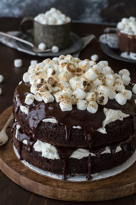 Hot Chocolate Cake with marshmallow buttercream! Made with real hot chocolate and topped with toasted marshmallows! Dessert Marshmallow, Hot Chocolate Cake Recipe, Chocolate Marshmallow Cake, Pumpkin Roll Recipe Easy, Hot Chocolate Cake, Pumpkin Roll Recipe, Marshmallow Cake, Pumpkin Rolls Recipe, Marshmallow Buttercream