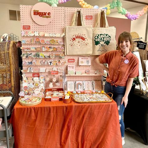 @shop.emilyc.designs shared a photo on Instagram: “MARKET DAY!🧡 I just realized I’ve worn orange to every single market. Can you tell it’s my favorite color?😄 come visit me at the…” • Apr 16, 2022 at 3:47pm UTC Craft Store Booth, Single Table Vendor Booth, Art Display Booth Ideas, Artist Market Booth, Colorful Booth Design, Art Market Stall Display Ideas, Art Market Table Display, Market Stands Display, Art Booth Design