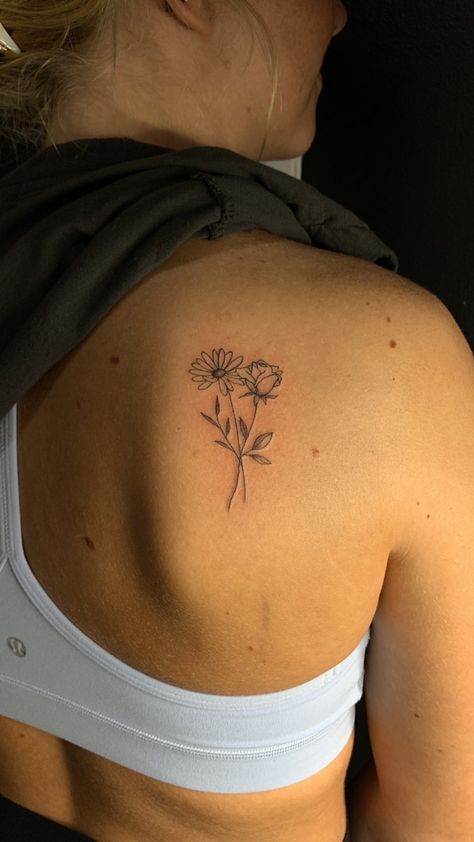 Tattoo Small Ideas Meaningful, Flower Tattoo On Back Of Shoulder, 3 Different Flowers Tattoo, Sunflower And Rose Bouquet Tattoo, July And May Birth Flower Tattoo, Aster And Rose Flower Tattoo, Rose Wildflower Tattoo, Cute Elegant Tattoos, Best Small Tattoo Placement For Women