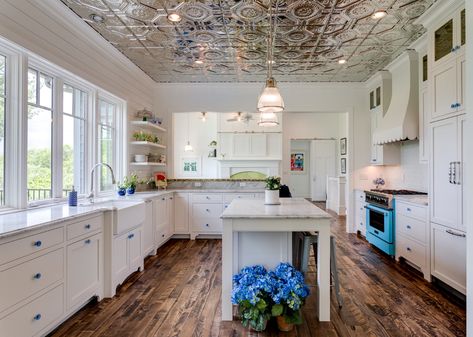 A new generation of DIY designers still love the farmhouse look but they want a more authentic approach. Here's what you need to know about how farmhouse style has changed. Metal Tin Ceiling, Tin Ceiling Backsplash, Travertine Floor Tile, River Rock Fireplaces, American Tin Ceiling, Tin Ceilings, Tin Tiles, Rock Fireplaces, Large Centerpiece