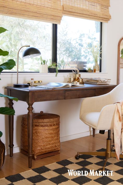 Crafted of wood with a vintage walnut finish, our Cynthia Vintage Walnut Desk features a conveniently hidden drawer. This storage desk provides a spacious work surface suitable for any work-from-home task. Taking its antique appeal from the spool-style leg posts, this timeless piece also complements mid-century office chairs and modern furniture. #WorldMarket #CynthiaCollection #WFH #HomeOffice #VintageHomeDecor Desks As Nightstands, Dark Wood Office Furniture, Office With Dark Wood Desk, Vintage Desk Home Office, Home Office Desk By Window, Office With Antique Desk, Danish Home Office, Walnut Desk Office Decor, Living Room Desk Decor