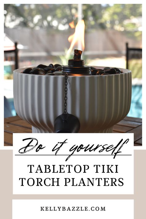 These tiki torch planters are so easy to make and they will immediately level up your outdoor space. You can purchase all of the items from Walmart and create a unique fire bowl for less than those other pre-made tabletop tiki torches. Tap this pin to get the links to everything you need to make your own. Patio Torches Ideas, Diy Table Tiki Torch, Diy Table Torch, Planter Tiki Torch, Patio Tiki Torch Ideas, Tiki Torches On Deck, Diy Tiki Torches, Tiki Torch Centerpiece Ideas, Outdoor Tiki Torch Ideas