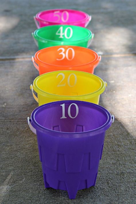 Bucket Ball Toss – you will need 5 buckets, 3 soft balls, and sticky numbers. I used my vinyl cutter to make numbers for each bucket, you could also use sticky letters. Cost – $6 Diy Outdoor Games, Outside Games, Outdoor Games For Kids, Water Games, Water Party, Carnival Birthday, Summer Games, Backyard Games, Carnival Games