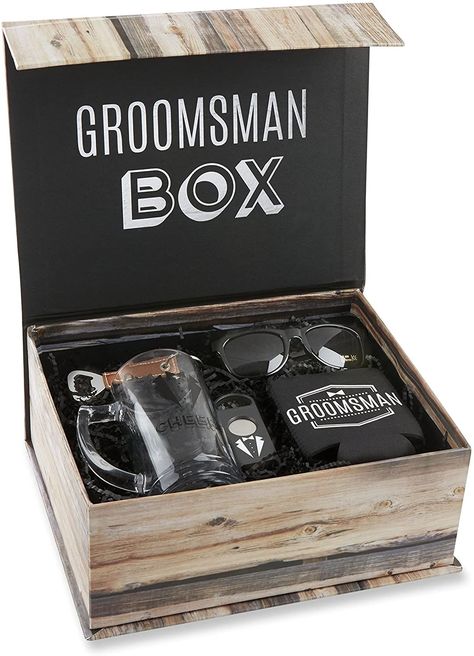 Can’t decide on one specific gift? Give a groomsmen gift box with a few small items or a set of items that go together. One popular groomsmen gift box idea is a nice wooden box with a small bottle of whisky, a nice, possibly engraved glass, and their preferred mixer. Groomsmen Kit, Groomsmen Boxes, Groomsman Proposal Box, Groomsmen Gift Box, Wedding Kit, Wedding Gifts For Groomsmen, Wine Gift Baskets, Groomsmen Proposal, Bottle Opener Keychain