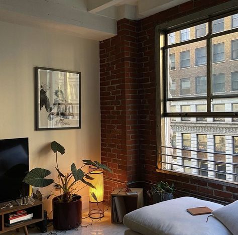 Loft Apartment Spiral Staircase, Messy New York Apartment, Sophia Kelly Apartment, Nyc Brick Apartment Aesthetic, Apartment Aesthetic Los Angeles, Brick Wall Apartment Aesthetic, Men’s Apartment Aesthetic, Nyc Brick Apartment, Rustic Apartment Aesthetic