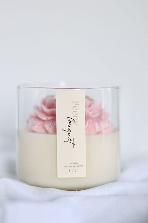 Experience the beauty of spring all year round with our Peony Bouquet candle. The delicate but bold scent of magnolia, peony, and freesia will transport you to a blooming garden. The clean and graceful finish of powder and wood notes will leave you feeling refreshed and inspired. - Reusable glass jar - Vegan Soy Wax - Toxin & Cruelty Free - Eco-friendly - Clean burning - Phthalate-Free Fragrance - Hand-poured - Lead-free cotton wicks Jar Candles Ideas, Unique Candle Containers, Floral Candles, Peony Candle, Flower Candles, Candle Logo, Homemade Scented Candles, Sweet Candles, Spring Candles