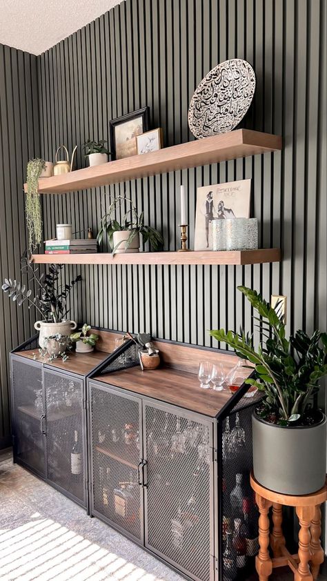 Slat Walls With Shelves, Slat Accent Wall With Shelves, Wood Slat Wall With Floating Shelves, Diy Wood Slat Wall Living Room, Slat Wall Bar Ideas, Slat Wall Ideas Dining Room, Slat Accent Wall Dining Room, Slat Wall In Kitchen, Slatted Wall Shelves