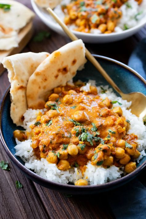 These Coconut Curry Chickpeas are vegan comfort food in a bowl. The chickpeas are braised in a coconut curry sauce and served over rice. Quick, easy, delicious dinner | ThisSavoryVegan.com #thissavoryvegan #fallrecipes #vegancurry Chickpea Indian Curry, Easy Summer Vegetarian Meals, Chickpea Rice Bowl, Mila Core, Coconut Curry Chickpeas, Coconut Curry Vegetarian, Easy Curry Recipes, Vegan Indian Food, Coconut Chickpea Curry