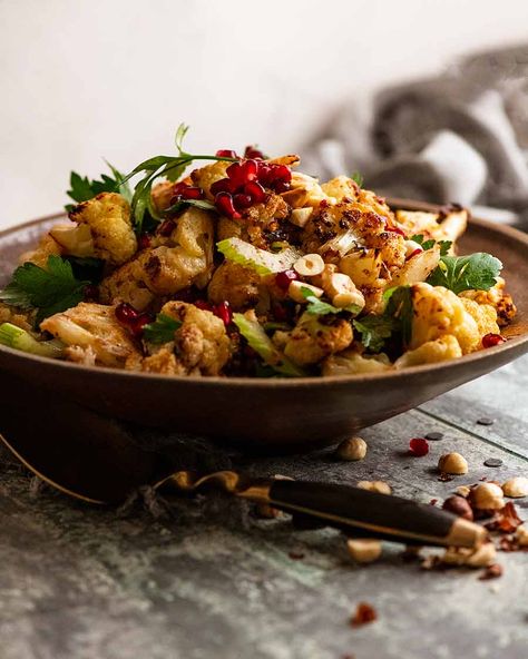 Cauliflower Salad in a rustic bowl, ready to be eaten Pomegranate Recipes Salad, Chicken Marbella, Roasted Cauliflower Recipe, Yotam Ottolenghi Recipes, Roasted Cauliflower Salad, Cornish Hen, Ottolenghi Recipes, Roasted Cauliflower Recipes, Rustic Bowl