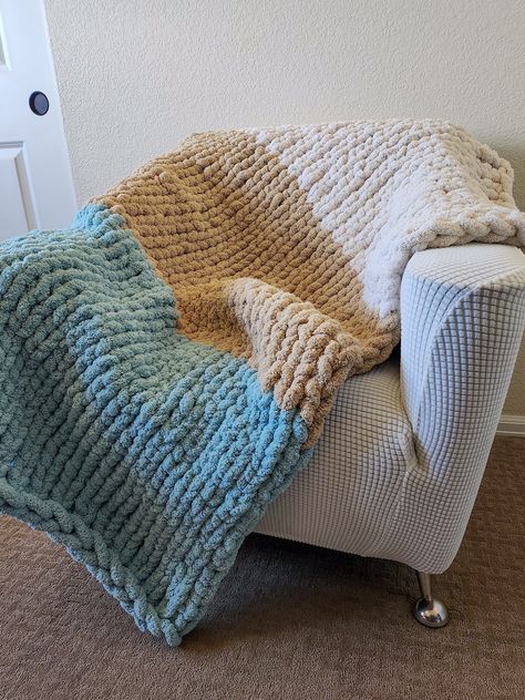 This chunky throw blanket is handmade with incredibly soft and fluffy chenille yarn, in the colors of ivory, beige, and spa blue. It is an elegant throw that aesthetically elevates any room. When curling up  with this blanket you will feel as if you are wrapped in a cloud. The knit is cozy and warm, yet still breathable and airy. From cool Spring evenings to brisk Winter nights, this is the perfect blanket for any weather and any occasion. Crochet Blanket Fluffy, Chunky Blanket Color Combos, Chunky Yarn Blanket Ideas, Blue Chunky Knit Blanket, Knotted Blankets, Cool Blankets, Chunky Throw Blanket, Chunky Blanket Pattern, Chunky Knit Blanket Pattern