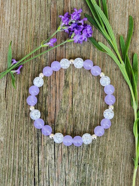 Look lovely in lavender with this gorgeous lavender jade and glass beaded gemstone bracelet.  Gemstones: Lavender Jade, Crackled Glass.  Beads: 8mm  Bracelet will stretch to fit. Glass Beads Jewelry Ideas, Glass Beads Ideas, Lavender Beaded Crystal Bracelet For Gifts, Elegant Lavender Beaded Bracelets With Gemstone, Elegant Lavender Gemstone Beaded Bracelets, Elegant Lavender Beaded Bracelet, Hand-strung Lavender Beaded Bracelets, Lavender Bracelet, Make Clay Beads