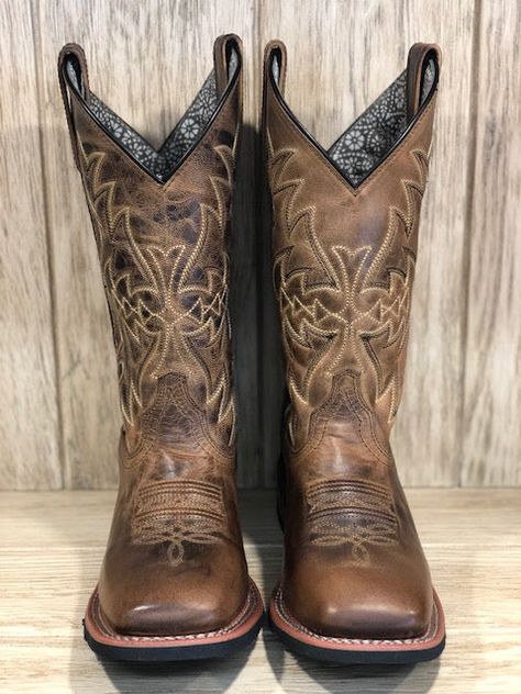 Get a great look and lasting comfort with the Anita Cowgirl Boots from Laredo. These boots have durable leather construction with fancy stitching along the shaft. They have a comfortable orthotic insole and broad square toe design, plus Laredo's Cowboy II outsole for traction, but ease in and out of the stirrup. Whether you're in or out of the saddle, look and feel great in these gorgeous Anita boots. Genuine leather upper Fancy stitching 11" shaft 1.5" Stockaman Heel Circumference: 15" Contrast Square Toe Cowgirl Boots, Cowgirl Boots Square Toe, Western Boots For Women, Tan Square, Trajes Country, Cute Cowgirl Boots, Cowgirl Boots Square Toed, Rodeo Boots, Cowboy Chic