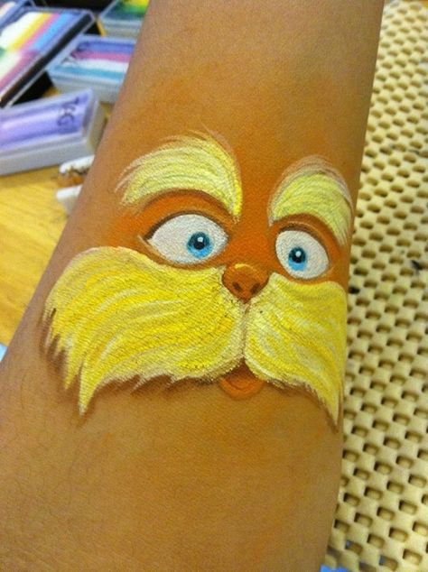 the lorax face painting | Lorax with nice shading. Doctor Suess, Diy Face Paint, Face Paint Ideas, Face Doodles, Cheek Art, Dr. Seuss, Face Painting Tutorials, Festival Face, Kids Face Paint