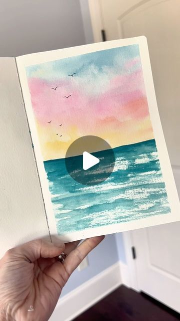 Andrea Nelson on Instagram: "This simple summer sketchbook page is the perfect thing to try if you’re new to watercolor or if you just want something that’s really easy but will make you super proud! Supplies are my brand and are on my page   Supplies: Watercolor sketchbook 24 color essential palette Size 8 round brush Artist tape .2 pen Dr martins bleed proof white  #easyart #easywatercolor #summerart #watercolorbeach" Summer Sketchbook, Andrea Nelson Art, Watercolour Challenge, Busy Mind, Relaxing Art, Watercolor Sunset, Handmade Paint, Loose Watercolor, Beach Watercolor