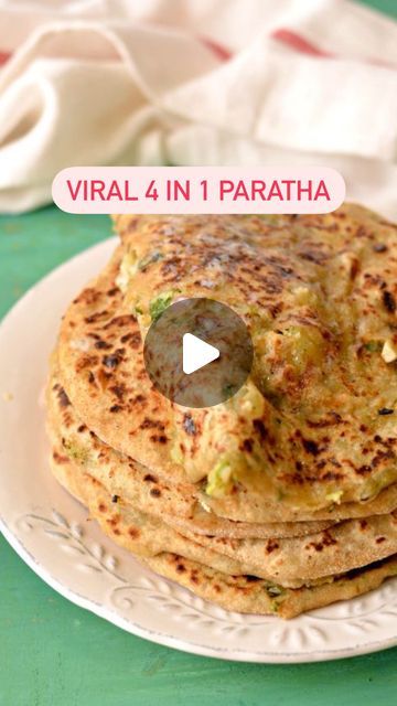 Dhruvi Jain on Instagram: "✨Unlock the flavor explosion with this 4-in-1 paratha recipe that’s taking the internet by storm! 🌟  The viral 4-in-1 paratha that’s got 31M views! Let’s see if it lives up to the hype😋🫓  You can should any 4 filling of your choice 😋🌿  I have used: - First filling is Besan, spices, sauf & oil - Second filling is Paneer, mint leaves & chaat masala  - Third is Capsicum  - Forth is Cheese, chilli flakes & oregano   I have used Homemade Butter 🧈 (the recipe is already shared)  [viral recipe, viral, paratha, Indian food, cheese, paneer, Besan, 4-1 paratha]  #4in1 #4in1paratha #viralreel #viralrecipes #trendingrecipe #mealideas #paratha #paratharecipes" Alu Paratha Recipes, Alu Paratha, Jain Recipes, Paratha Recipe, Paratha Recipes, Chaat Masala, Homemade Butter, Trending Recipes, Chilli Flakes