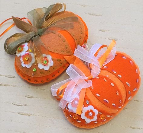 Handmade  Halloween Harvest  felt pumpkin ornament  approx 5" in size  choose from either  orange with olive green bow or orange and white bow felt flower applique  stuffed, design stitched Fall Entryway Decor, Felt Fruit, Fall Ornaments, Pumpkin Ornament, Felt Pumpkins, Felt Crafts Patterns, Felt Halloween, Orange Pumpkin, Felt Applique