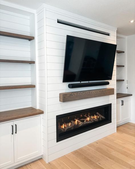 media wall with fireplace • Instagram Fireplace With Cupboards Either Side, Small Living Room With Fireplace And Windows, Built In Shelves Living Room With Electric Fireplace, Built In With Tv And Fireplace, Entertainment Unit With Fireplace, Built In Shelves With Electric Fireplace, Built In Shelves Living Room Electric Fireplace, Basement Built Ins With Tv And Fireplace, Diy Media Wall With Fireplace