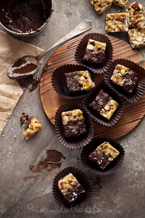 A mixture of nuts and seeds are held together by caramelized honey, enrobed in a rich layer of dark chocolate and then sprinkled with a hint of fleur de sel. Fresh Fruit Recipes, Healthy Nuts, Nut Recipes, Chocolate Nuts, Homemade Candies, Chocolate Dipped, Fruit Recipes, Free Desserts, Sweet And Salty