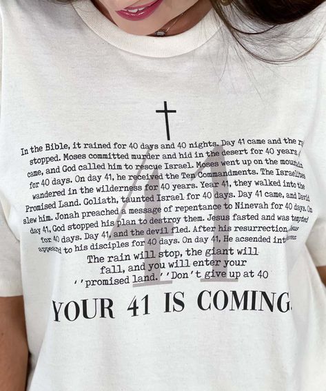 Introducing our "Your 41 Is Coming Graphic Shirt," a meaningful and inspirational addition to your faith-based wardrobe. Available in sizes YXS through 5XL, this natural-colored shirt features the encouraging phrase "Your 41 Is Coming," accompanied by stories from the Bible that highlight the significance of the number 41 and the good things that come with it. Crafted from high-quality, soft materials, this shirt ensures all-day comfort, making it perfect for church services, Bible study groups, spiritual gatherings, or casual wear. The "Your 41 Is Coming Graphic Shirt" serves as a reminder of faith, positivity, and perseverance, drawing inspiration from biblical events where the number 41 marked a time of breakthrough and blessings. Celebrate your faith and encourage others not to give up Encouraging Phrases, Bible Shirts, Bible Journal Notes, Spiritual Shirts, Christian Post, Bible Study Group, Scripture Reading, Scripture Art, Prayer Journal