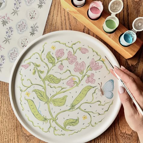 Ready to bake! @clay_and_coffee 🎨✍🏼 #ceramicpainting #sweetpea #butterfly #flowers #art #botanicals #southafrica Butterfly Ceramic Painting, Creative Pottery Painting Ideas, Flowers Pottery Painting, Cute Pottery Painting Ideas Plates, Plate Painting Ideas Diy, Pottery Paint Ideas, Painted Plates Ideas, Pottery Painting Flowers, Flower Pottery Painting