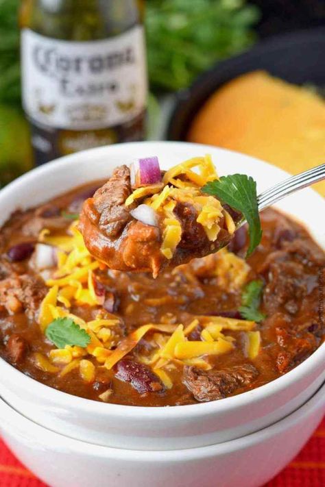 Ribeye steak chili in a white bowl with a spoon Best Steak Chili Recipe, Steak Chili Recipe, Chili Recipe Video, Steak Chili, Beef Chili Recipe, Leftover Steak, Bean Chili Recipe, Hearty Chili, Chili Recipe Crockpot