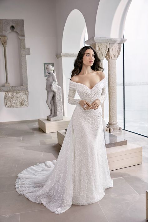 The Wedding Dress Designs That Every Bride Needs To See Off The Shoulder Fit And Flare Wedding Dress, Long Sleeve Wedding Dress Fit And Flare, Fit And Flare Wedding Dress Off Shoulder, Ronald Joyce Wedding Dress, Tight Wedding Dress With Sleeves, Off The Shoulder Sheath Wedding Dress, Wedding Dress Removable Sleeves, Mermaid Wedding Dress With Sleeves, Sequin Wedding Dress