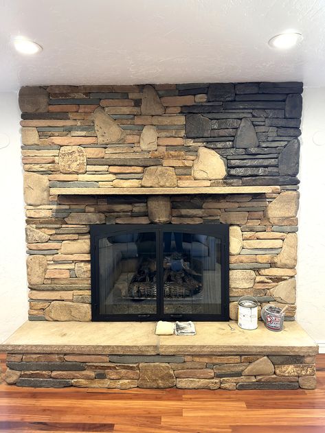 Updating an Old Stone Fireplace With Dark Grey Paint Wash | Before and After – Pine and Prairie Home Stone Fireplace Renovation, Dark Living Room With Fireplace, Lime Washed Stone Fireplace, Painted Stone Fireplace Before And After, Update Stone Fireplace, Old Stone Fireplace Makeover, River Rock Fireplace Makeover, Painting Stone Fireplace, Paint Stone Fireplace