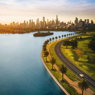 Just give us a minute to take in this view 😍 @danniexdough captured this stunning scene of @visitmelbourne's #AlbertPark getting its glow on recently. Located just 10 minutes by tram from the #Melbourne CBD, the park is a popular spot for jogging, cycling, dog walking, as well as sailing and rowing on #AlbertLake. Tip: Stock up on fresh produce at the @southmelbournemarket for an afternoon picnic by the lake. #seeaustralia #visitvictoria #visitmelbourne #melbournelife Albert Park Melbourne, Lake Landscaping, Melbourne Skyline, Australia Landscape, Visit Melbourne, Urban Landscape Design, Albert Park, Foreign Travel, Island Destinations