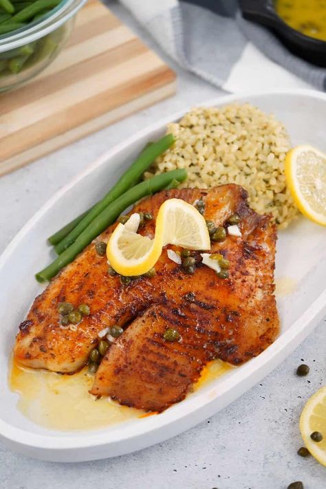 Smoked Blackened Tilapia with Lemon Butter Caper Sauce • Smoked Meat Sunday Smoked Flounder, Fish On The Smoker, Smoked Tilapia, Smoked Tilapia Recipes, Tilapia Marinade, Smoker Cooking Recipes, Smoked Fish Recipe, Blackened Tilapia, Frozen Tilapia