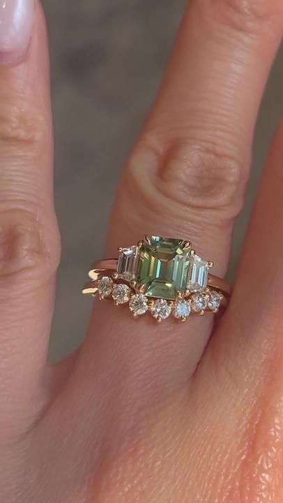 Replying to @Sarah🪬 Wait for this perfect green emerald cut engagemen... | emerald engagement ring | TikTok Vintage Emerald Wedding Ring Sets, Wedding Rings Engagement Emerald Green, Green Emerald Engagement Ring With Band, Wedding Rings With Green Stones, Extra Engagement Rings, Green Sapphire Emerald Cut Engagement Ring, Emerald Cut Green Engagement Ring, Light Emerald Engagement Ring, Wedding Ring Green Stone