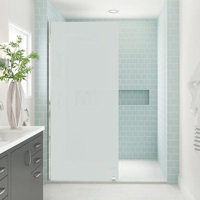 The Elyse xl frameless fixed shower door panel collection from Aston provides an open-concept, stately 80 in. high interior design solution to any finished three wall or corner bathroom alcove. Constructed of thick, tempered 3/8 in. (10 mm) ultra-bright frosted glass, providing the ultimate in privacy and alluring contrast, the Elyse xl can be installed either left or right-handed, and is offered in width models 30 to 38 in. with 6-desirable hardware finish options. The tall 80 in. panel can be Frosted Glass Shower Wall, Partial Shower Door, Frosted Glass Interior Doors Bathroom, Opaque Shower Doors, Small Glass Shower Ideas, Frosted Shower Glass Door Ideas, Frosted Glass Door Design, Fixed Shower Glass Panel, Frosted Shower Door