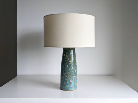 "Get a discount on the second lamp with code SECOND SIZES: 18\" / 45 cm high with shade 11\" / 28 cm high base 5\" / 13 cm diameter INFORMATION: Texture: as this is an handmade glazed lamp, every texture is different and the lamp you get will not match exactly the picture Wall plug: included according to your location - North America, Europe or UK Socket: E27 metalic holder, without lamp harp Lamp bulb: not included Customizations: custom colors and sizes available, contact me for more information. ---------------- This ceramic lamp was made in Portugal, using the potter wheel. All our ceramic pieces are handcrafted from the start to finish, using only our hands and the potter wheel as tools, which aren't industrial or mass-produced. Any item you purchase is one of a kind. There are no two Wheel Thrown Ceramics, Pottery Lamp, Ceramic Table Lamp, Wall Plug, Ceramic Lamp, Lamp Bulb, Ceramic Table Lamps, Beautiful Lamp, Ceramic Table