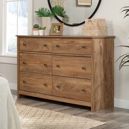 Have enough storage until the cows come home. This dresser from the River Ranch collection offers 6-drawer storage for any style of home decor. This bedroom dresser features six drawers on metal runners and safety stops. The lower four drawers of this 6-drawer dresser are extra deep, for thick sweaters, bulky denim, large linens, and more. Store socks, T-shirts, or other necessities in the top two drawers of this bedroom dresser, while the top surface provides additional storage for a jewelry bo Drawer Bedroom, Bedroom Dresser, Wood Dresser, Double Dresser, Drawer Storage, Thick Sweaters, 6 Drawer Dresser, Bedroom Dressers, Spare Room