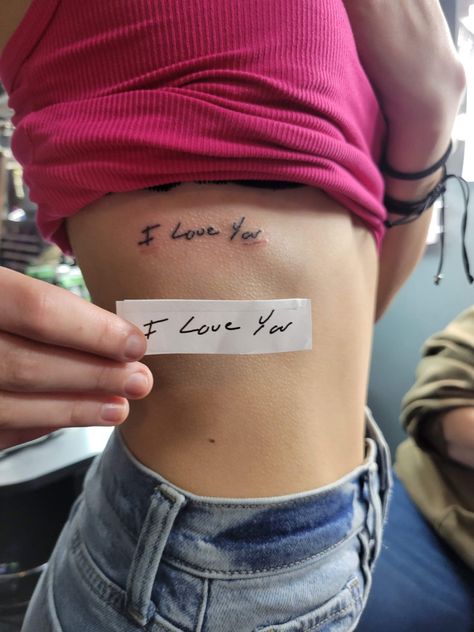 Tattoo Ideas For Your First Tattoo, Tattoos For First Love, Tattoos To Get For Mom, I Love You Rib Tattoo, Simple Tattoos Ribs, Tattoos For Ur Mom, Hand Writing Tattoo Memorial, Tattoos For Lossed Loved Ones, Meaningful First Tattoos