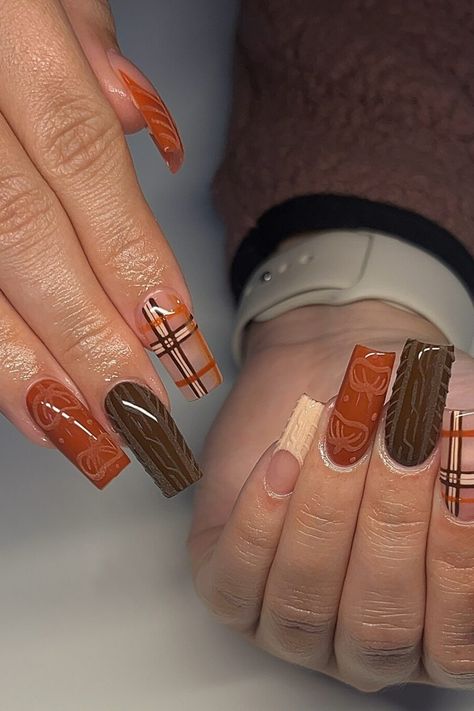 Hands with long, decorated nails featuring brown and orange plaid and patterns. Cute Thanksgiving Nails Acrylic Long, Classic Square Nails, Fall Nail Sets, November Nail Designs, Fall Thanksgiving Nails, Fall Elements, Orange Nail Designs, Thanksgiving Nail Designs, Turkey Art